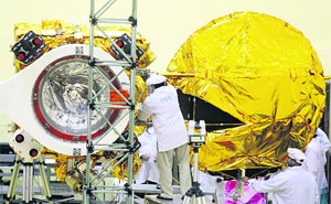 An ISRO scientist gives a final shape to the Mars Orbiter Mission at the Clean Room in Bangalore. 