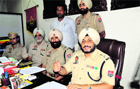 SSP Ravcharan Singh Brar addresses a press conference about their arrest and recovery of vehicles stolen from the city