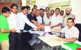Members of the Guru Ravidas Sabha submit a memorandum to Deputy Commissioner Kamal Kishore Yadav in Bathinda on Thursday.