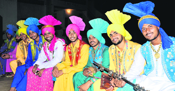 Boys await their turn to perform Bhangra at the foundation day function of Jaipalpur village on Thursday.
