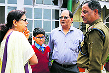 NIshants parents talk to a police official in Mussoorie on Thursday