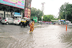 The Rajpur road at Ashley Hall turned into a rivulet following heavy rain in Dehradun on Thursday
