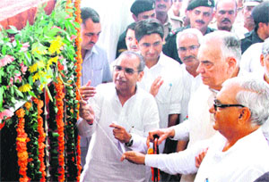 Chief Minister Bhupinder Singh Hooda and former Union minister Dr Balram Jakhar (second from right) inaugurate Balika Vidyalaya Bhawan at Daboda in Jhajjar on Thursday.