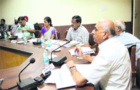 Rajan Kashyap, performance management advisor of MAGSIPA, takes presentations from deputy commissioners at a meeting in Jalandhar on Thursday