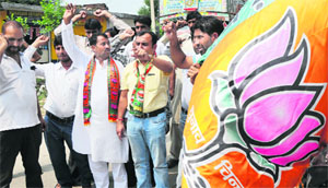 Activists of the BJP Muslim Morcha stage a protest against the Uttar Pradesh Government, in Jammu on Thursday.