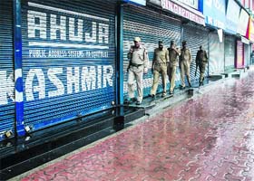 Shops with their shutters down in Srinagar on Thursday