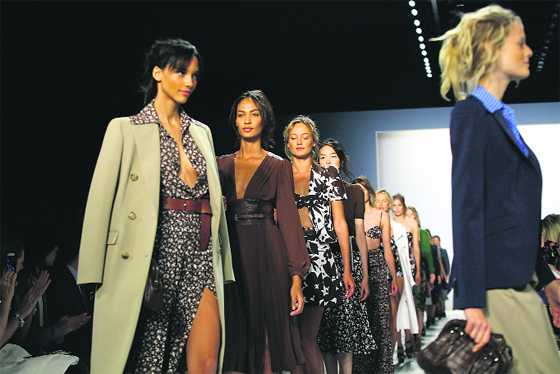 Models present creations from Michael Kors Spring/Summer 2014 collection during New York Fashion Week. 