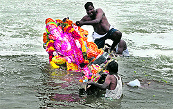 Fishermen carry Lord Ganeshas idol for immersion on Thursday