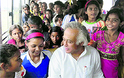 Minister for Rural Development Jairam Ramesh takes a bus ride with tribal girls during his visit to a village near Ranchi on Thursday