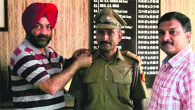 Prof Rajeev Kumar Varshney being commissioned as Associated NCC Officer in Bathinda on Friday.