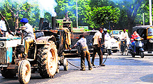 MC workers spruce up the road to be taken by the PMs convoy in Chandigarh on Friday