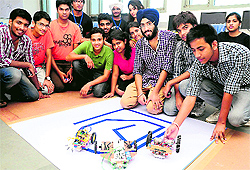 Students display their instruments at the University Institute of Engineering and Technology in Chandigarh on Friday