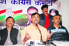AICC leader Prem Chand Mishra addresses mediapersons in Shimla on Friday.