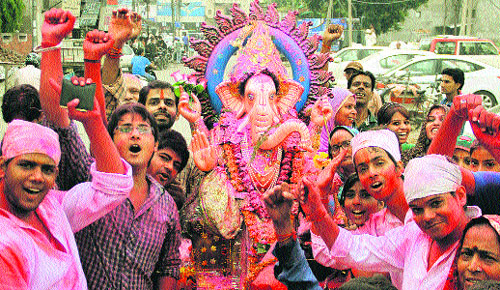 Devotees take idol of Lord Ganesha for immersion in Jalandhar on Friday. 