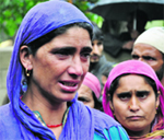 Grieving relatives of Hilal Ahmad Dar of Rajpora, who was killed in a cloudburst at Drubgam village in Pulwama on Friday. Tribune photo: Amin War 