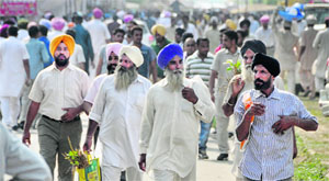Heavy rush of farmers on the first day of Kisan Mela at the PAU in Ludhiana on Friday. 