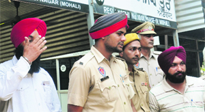 The accused, Baba Panesar and Gursewak Singh, appear in the district courts in Mohali on Friday.
