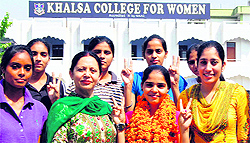 Khushbir Kaur, student of the Khalsa College for Women, being honoured for winning the gold medal in the walking event in the 53rd Open National Athletic Meet held in Ranchi, by students and staff of the college in Amritsar on Saturday