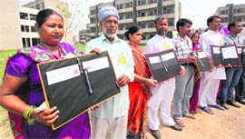 Beneficiaries in a jubilant mood after receiving house allotment letters in Chandigarh on Saturday.
