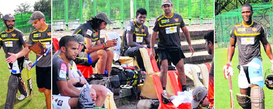 (From left) Sunrise Hyderabad player Shikhar Dhawan; players take rest; and (right) Darren Sammy during a training session at the Cricket Stadium, Sector 16, in Chandigarh on Saturday.