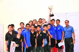 Winners of the swimming competition with their trophy on Saturday