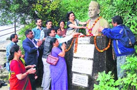 Dignitaries pay homage by offering floral tributes at the bust of Sri Chand Bhagwan in Haridwar on Saturday