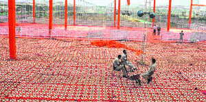 Work on a pandal on at the rally venue in Rewari. 