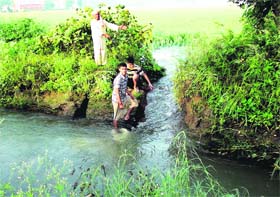 A breach in the Shah Canal at Budhewa village in Mukerian