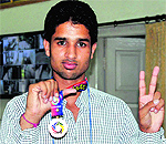 Jaspreet Singh, a student of Government Rajindra College, shows the bronze medal he won at the tae kwon do competition held in South Korea