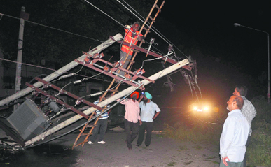 An uprooted electricity transformer in Phase IV, Mohali