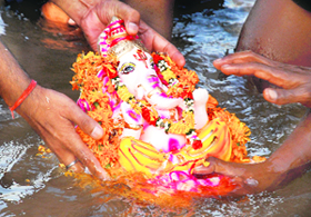 Devotees immerse an idol of Lord Ganesha in the Ghaggar in Panchkula on Sunday.