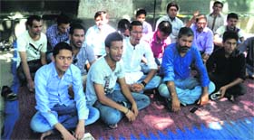 Members of the CPI (ML) stage a dharna in Dehradun on Sunday.
