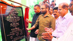 Urban Development Minister Preetam Singh Panwar lays foundation stone of the community centre at Suvakholi, near Mussoorie, on Sunday.