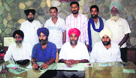 Jaspal Singh (white turban), Avtar Saini (red turban) and Sukhdev Singh (blue turban), brothers of late BJP legislator HN Saini, at a press conference in Nalagarh on Sunday.