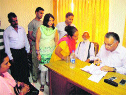 Transport Minister GS Bali listens to grievances of people at Nagrota Bagwan in Kangra on Saturday. 