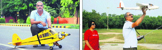 Lieutenant-Colonel Jasvir Singh with his aero-modeller; and (right) the colonel, along with his wife, demonstrates one of his aircraft in Jalandhar on Sunday.