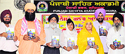 Dignitaries during the release of Dr Kulwinder Kaur Minhas' book "Dashmesh Pita Mere Ang Sang" at Punjabi Bhawan on Sunday
