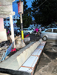 A signboard lies on the ground