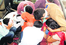 The police takes away couples caught indulging in immoral activity at Harchand Cinema in Bathinda on Monday. 