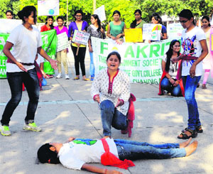 Students present a street play, Save Ozone, Save Earth, at the Sector 17 Plaza in Chandigarh on Monday. 