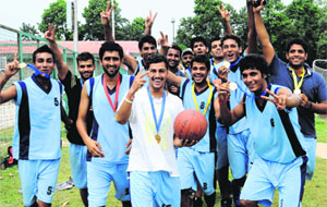 Cagers of GGDSD College, Sector 32, strike a pose after winning the Inter-College Basketball Championship for Men (A-division) in Chandigarh on Monday. 