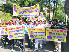 Kin of the deceased student take out a procession against the school authorities and the police in Mussoorie on Monday.