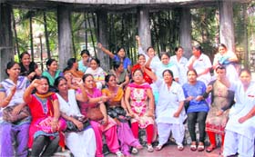 Nurses stage a protest in support of their demands in Dehradun on Monday
