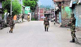 CRPF personnel on Monday patrol a street in Shopian district, which has been under curfew since September 7.