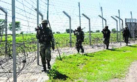 BSF men patrol the international border in the Akhnoor subdivision of Jammu district.