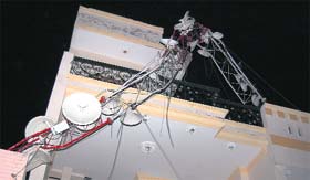 A mobile phone tower on the roof of a house gets damaged in Phagwara.