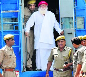 Self-styled godman Asaram arrives at the District Sessions Court in Jodhpur, Rajasthan, on Monday