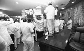 BSP legislators holding a protest in the Assembly on the first day of its monsoon session in Lucknow on Monday