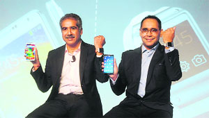 Vineet Taneja, Country Head - Samsung Mobile, and Manu Sharma (R), Director, at the launch of Galaxy Note 3 and Galaxy Gear in New Delhi on Tuesday.  