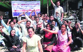 Shiksha Acharyas hold a dharna in support of their demands in Dehradun on Tuesday.